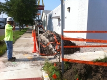 A construction crew member oversees the upgrade of existing fiber