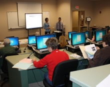 Image: Two instructors lead an Internet fundamentals course