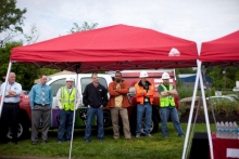 Construction workers listen as Horizon’s CEO Bill McKell delivers a speech