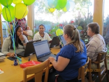 An Idaho Youth Corps member helps students search the Internet