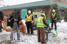 Image: Merit Network crews begin to feed fiber into the conduit.