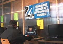 Job seeker sits at a computer.