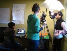 Three ReelGrrls students film a stop-animation scene for their project